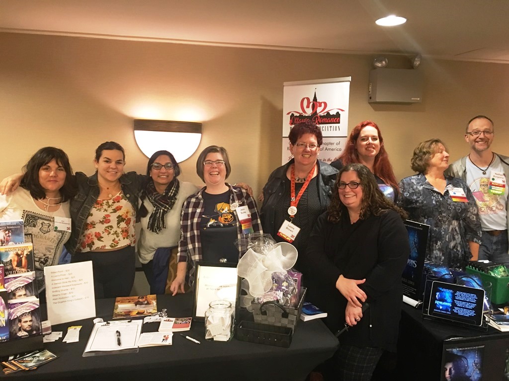 ORW members standing long a table at can-con 2019
